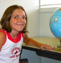 Girl next to globe